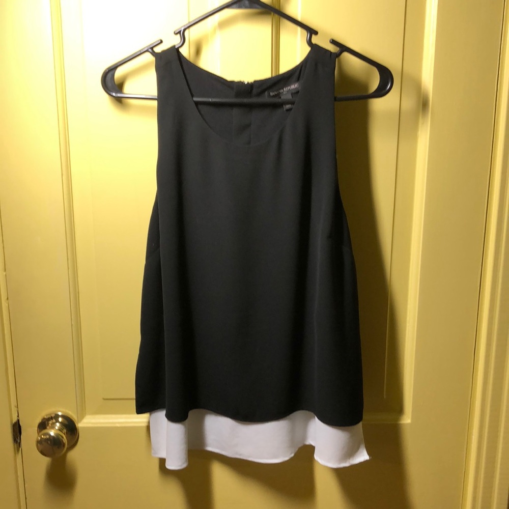 Banana Republic black sleeveless top with white underlay.